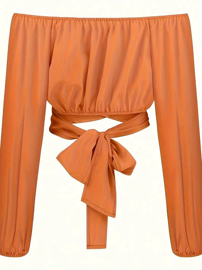 Oranje off-shoulder crop blouse met kruisbandjes op de rug 