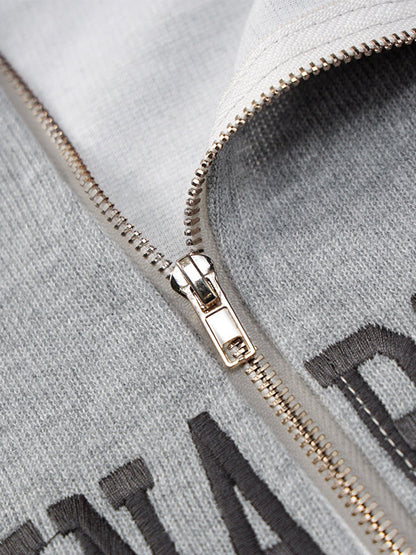 Grijs vintage gebreid sweatshirt met halve rits en letterborduurwerk