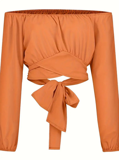 Oranje off-shoulder crop blouse met kruisbandjes op de rug 