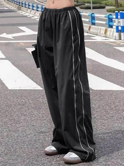 Pantalon de survêtement noir à jambe large avec passepoil