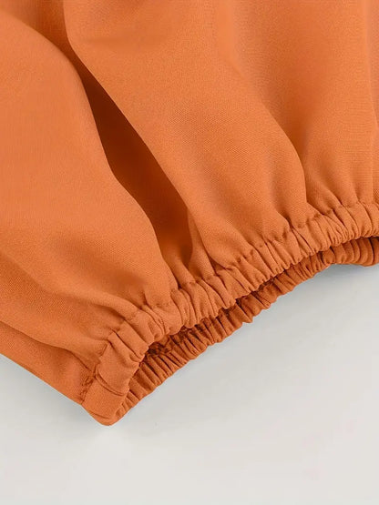 Oranje off-shoulder crop blouse met kruisbandjes op de rug 