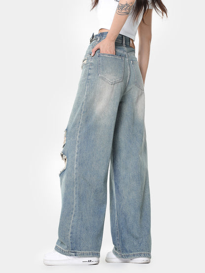 Blauwe vintage noodlijdende wijde pijpen gescheurde jeans